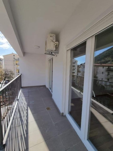 Apartment for sale in Budva in a new building with elevator and covered parking