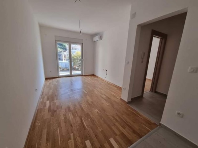 Apartment for sale in Budva in a new building with elevator and covered parking