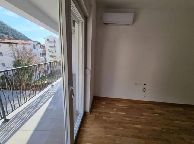 Apartment for sale in Budva in a new building with elevator and covered parking